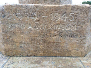Drayton St Leonard War Memorial step with the wording carved 1939 - 1945 Pte G A Wilkinson