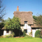 Thatched roof with chimney of Little Garden Cottage