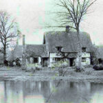 black and white picture of thatched cottage of Garden Cottages